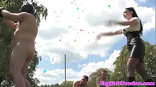 English femdoms punish submissive outdoors